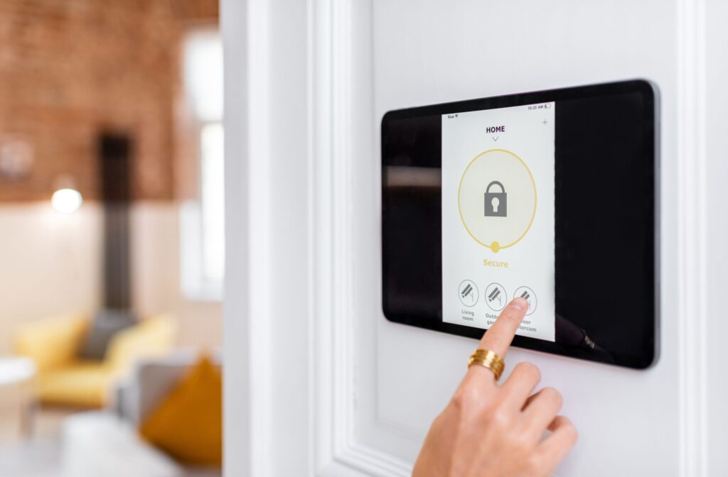 Person using touchscreen home security system panel