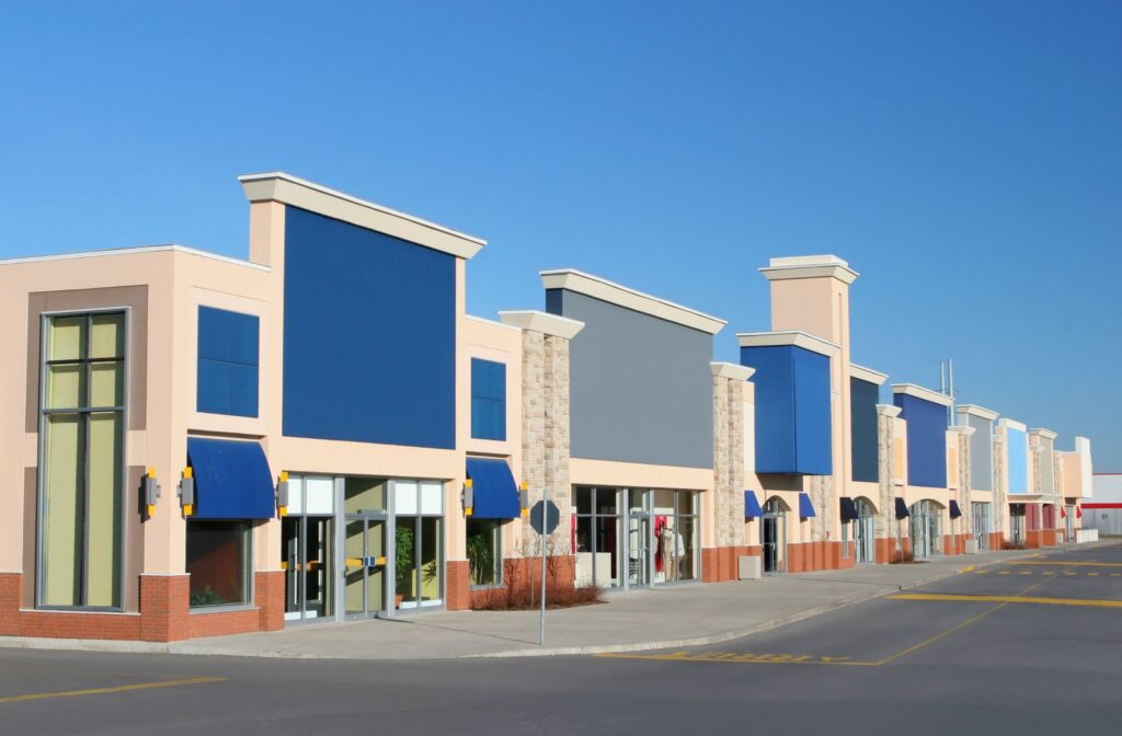 Modern retail strip mall with clear blue sky